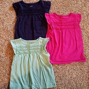 Three plain shirts with ruffles